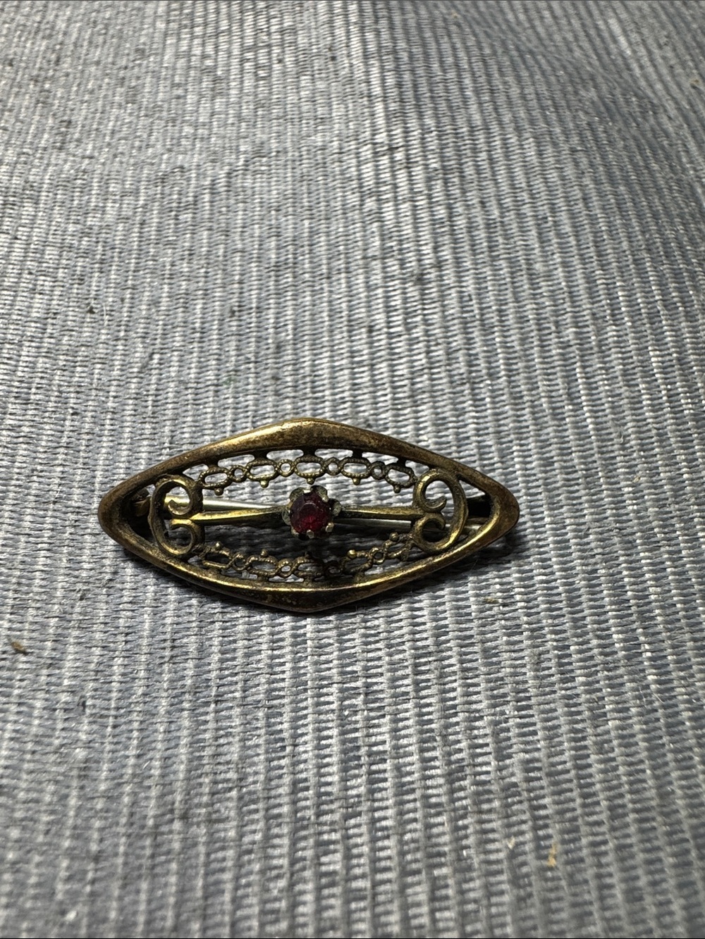 Vintage Source Unknown Gold-Tone Filigree Brooch with Red Stone
